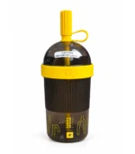 Nespresso Samra Origins Travel Tumbler 540ml with smoky transparent body, yellow silicone band and capped straw